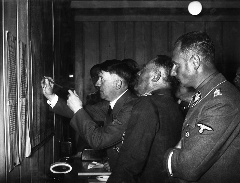 Adolf Hitler during a situation conference in his Wolfsschlucht I headquarters in Brûly-de-Pesche, Belgium, during the Battle of France, from Eva Braun's albums